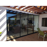 empresa especialista em fechamento de área de vidro com slide door Vila Pérola